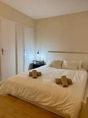 a bedroom with a large white bed with two pillows at Loft Premium en Barcelona in Barcelona