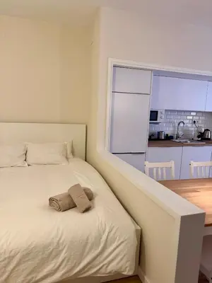 a bedroom with a bed with two towels on it at Loft Premium en Barcelona in Barcelona