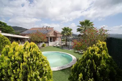 a house with a swimming pool in the yard at Bellavista in Argentona