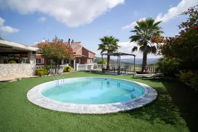 a small swimming pool in the middle of a yard at Bellavista in Argentona