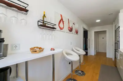 a kitchen with white walls and a white counter top at Mediterranean Soul Experience in Montgat