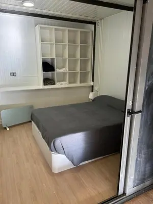 a bedroom with a large bed in a room at Apartamento con Piscina en sant Cugat del valles in Sant Cugat del Vallès