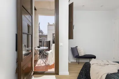 a kitchen and living room with a table and chairs at Canela Homes MIDTERM D'EN SERRA in Barcelona