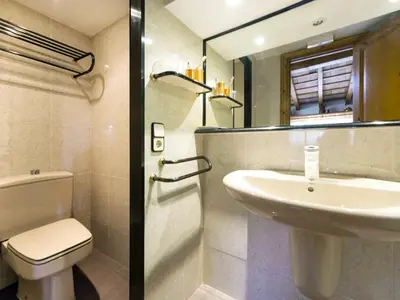 a bathroom with a sink and a toilet at Cal Tomas in Castellet