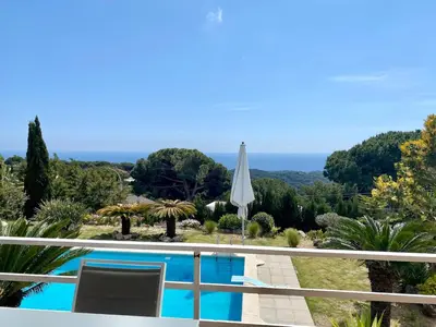 a villa with a swimming pool and a view at CAN FENICIA - 30 min to F1 & MotoGP - Intimate Villa, Private Pool & Sea View in Arenys de Munt