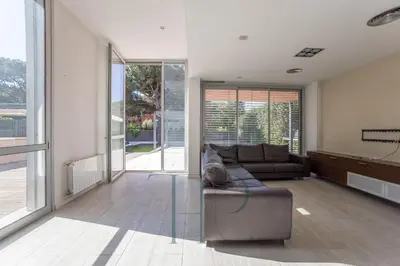 a living room with a couch and a television at Gavamar in Gavà