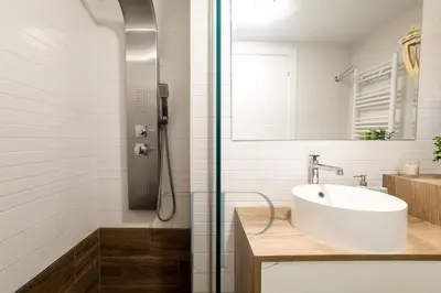 a bathroom with a sink and a shower at La Pineda in Castelldefels