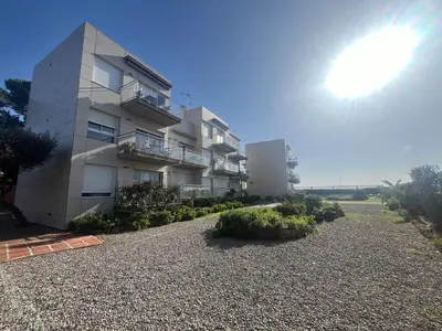 a large white building with a gravel driveway at Atico frente al mar! in Gavà
