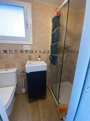 a bathroom with a toilet and a sink and a shower at House 50meters from the beach in Cunit