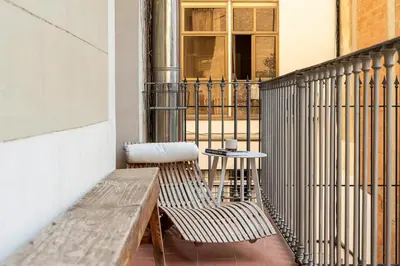 a dining room with a large wooden table and chairs at Canela Homes MIDTERM ELEGANCE in Barcelona