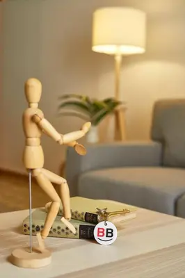 a wooden mannequin standing on a suitcase on a table at BBarcelona Perill Flat in Barcelona