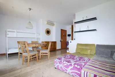 a living room with a table and a couch at Waves and sky in Montgat