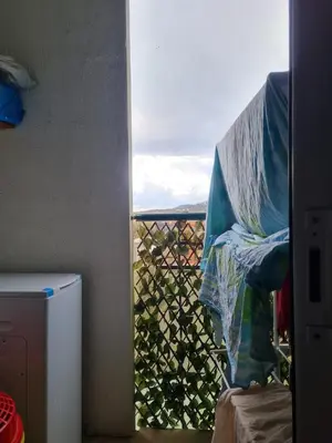 a view of a balcony with a fence and a window at Alojamiento luminoso y bien ubicado en Terrassa Barcelona in Terrassa