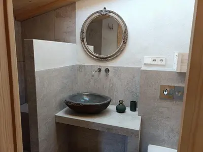 a bathroom with a sink and a mirror at El Freixe de l'Ylla in Els Hostalets