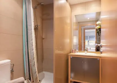 a bathroom with a sink and a shower at Lets Holidays Terrace Barcelona in Barcelona