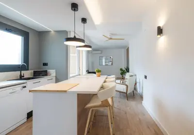 a kitchen with white counters and a white counter top at Stay U-nique Apartments Villarroel II in Barcelona