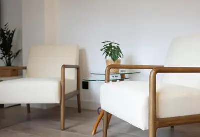 two white chairs and a table in a room at Stay U-nique Apartments Villarroel II in Barcelona