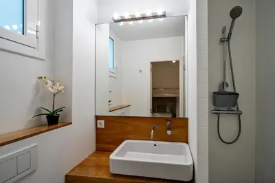 a bathroom with a sink and a mirror at Habitat Apartments Vila in Barcelona