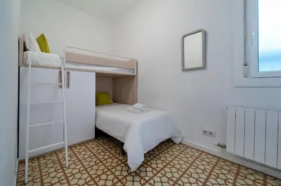 a bedroom with a bunk bed in a room at Habitat Apartments Vila in Barcelona