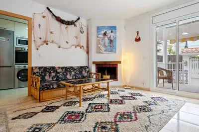 a living room with a couch and a table at Hauzify I Casa Ribera in Cunit