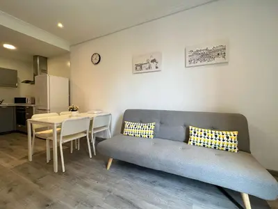a living room with a couch and a table at Stay Unique Apartments Mallorca III in Barcelona