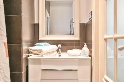 a bathroom with a sink and a mirror at Montroig Mar in Sitges