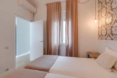 a hotel room with a bed and a window at Rambla Catalunya Sky in Barcelona