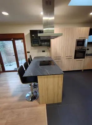 a kitchen with a black counter top in a room at Estrella Relax in Vallirana