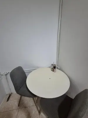 a white table and two chairs in a room at Mary home in Barcelona