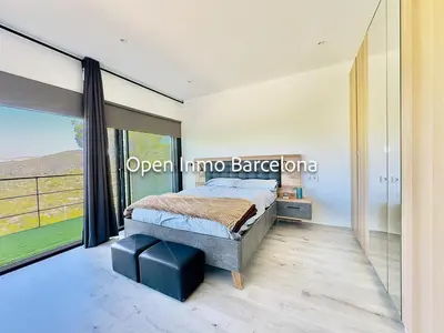 a bedroom with a bed and a large window at Alquiler temporal en Canyelles - OI01937 in Canyelles