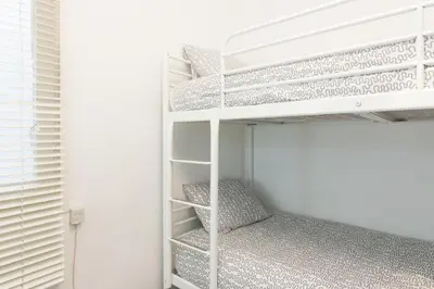 a bedroom with bunk beds in a room at Pubone AT Barberà del Valles in Barbera del Valles