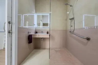 a bathroom with a sink and a glass shower at Habitación 1 NOU DE LA RAMBLA in Barcelona