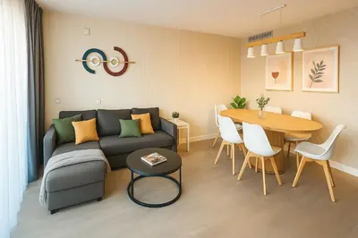 a living room with a couch and a table at Luz y Mar II in Barcelona