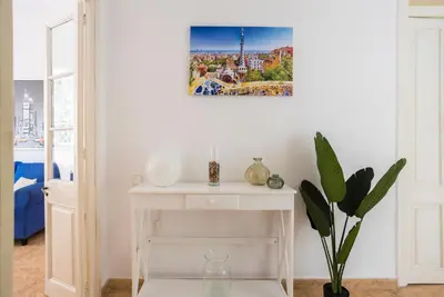 a white table in a room with a picture on the wall at Apartament Clot 2 in Barcelona