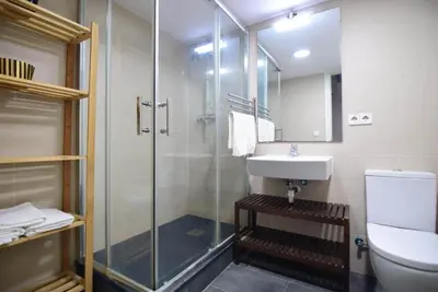 a bathroom with a glass shower and a sink at Apartment in the heart of Barcelona in Barcelona