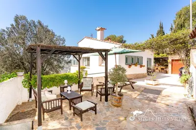 a kitchen with a refrigerator and a sink at Casa Sian Retreat near Sitges in Olivella