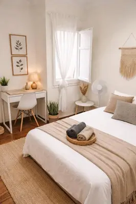 a bedroom with a bed and a desk and a window at One bedroom apartment in a high area Bcn in Barcelona