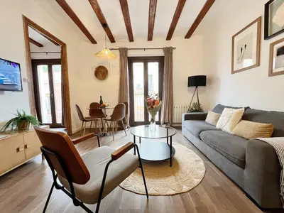 a living room with a couch and a table at Roser Apartment in Barcelona