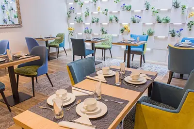 a dining room with wooden tables and chairs at Boutique Hostemplo Sagrada Familia in Barcelona