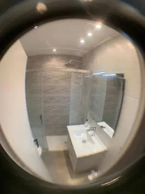 a bathroom with a white sink and a mirror at Stay U-nique Apartments Sitges Beach in Sitges