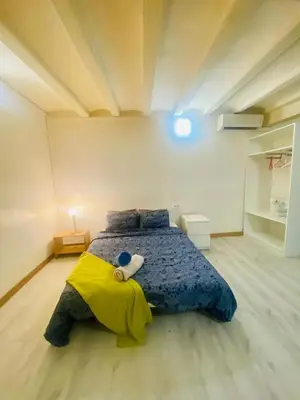 a bedroom with a bed with a stuffed animal on it at 11 Principal Barca in Barcelona