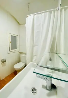 a bathroom with a tub and a toilet and a sink at 11 Principal Barca in Barcelona