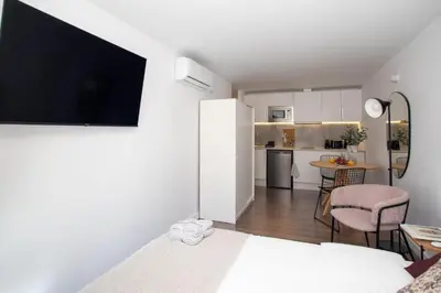 a room with a living room and a kitchen at Sunshine Studios Portside Gothic in Barcelona