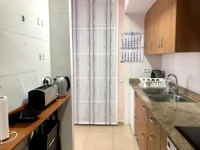 a small kitchen with a sink and a counter at Vivalidays - Estrella de Mar - Calella in Calella