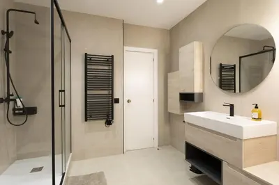 a bathroom with a sink and a mirror at Gran Vía Suites in Barcelona