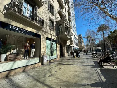 a city street with people walking on the sidewalk at MODERN ELEGANCE by MyRentalHost in Barcelona