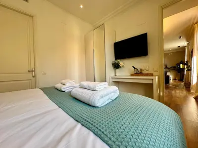 a hotel room with a bed with towels on it at MODERN ELEGANCE by MyRentalHost in Barcelona