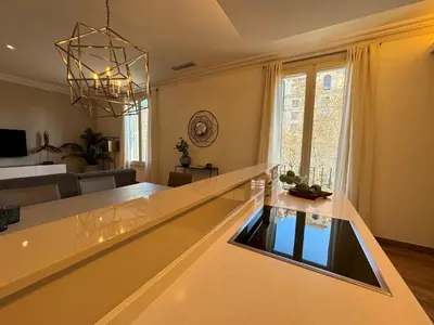 a kitchen and living room with a counter top at MODERN ELEGANCE by MyRentalHost in Barcelona