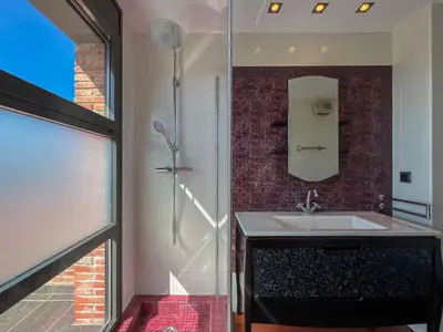 a bathroom with a sink and a shower at Stylish villa with saltwater pool in Caldes d'Estrac