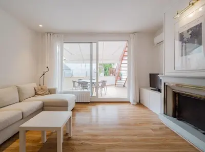 a bedroom with a bed and a desk and a chair at Large townhouse in St Cugat in Sant Cugat del Vallès